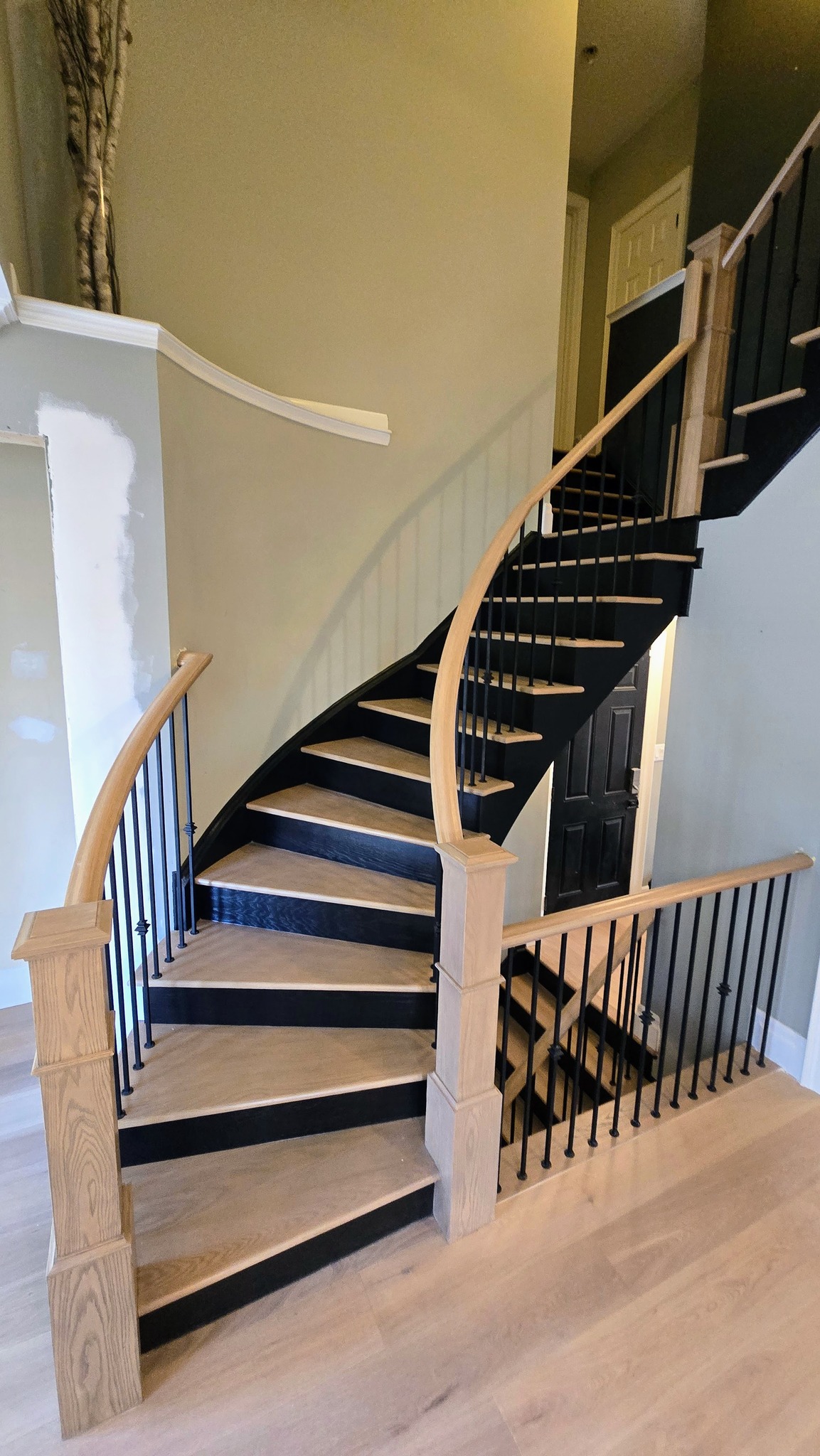 Sunlit living room renovation with custom millwork
